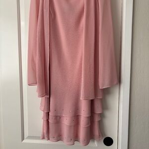 The bride. Light pink dress with jacket